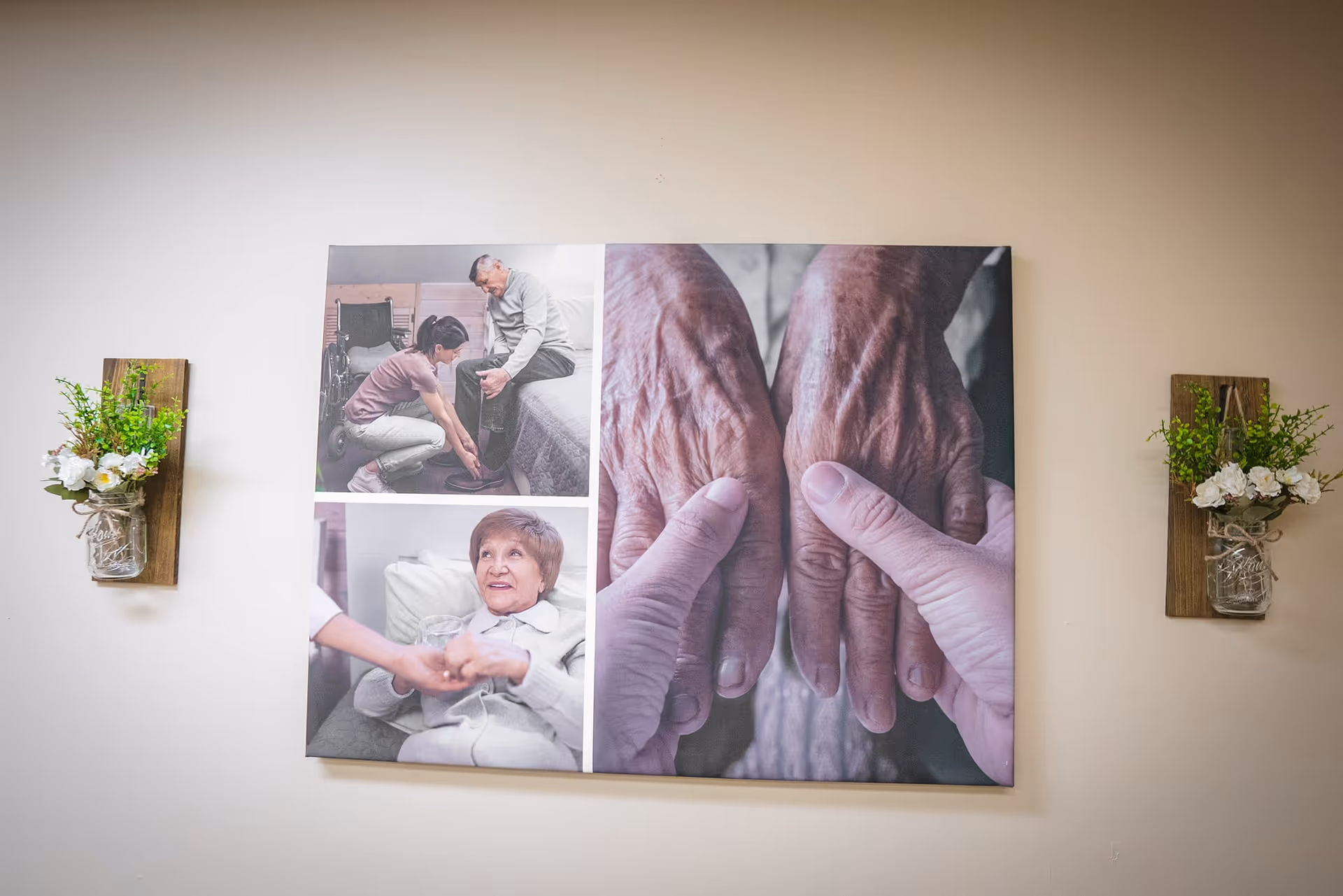 Interior wall displays a large multi-panel artwork of hands, flanked by flowered wall fixtures.