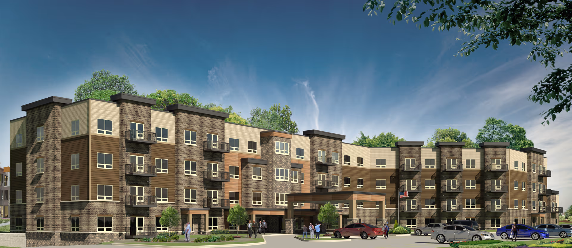 Modern four-story senior living building with balconies, an entrance canopy, landscaped grounds, parked cars and a few people under a blue sky.