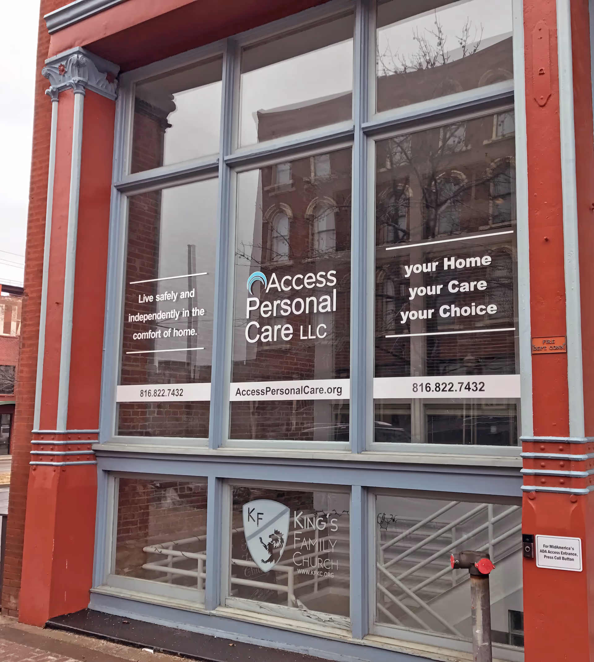 Exterior storefront windows display Access Personal Care LLC signage and slogans.