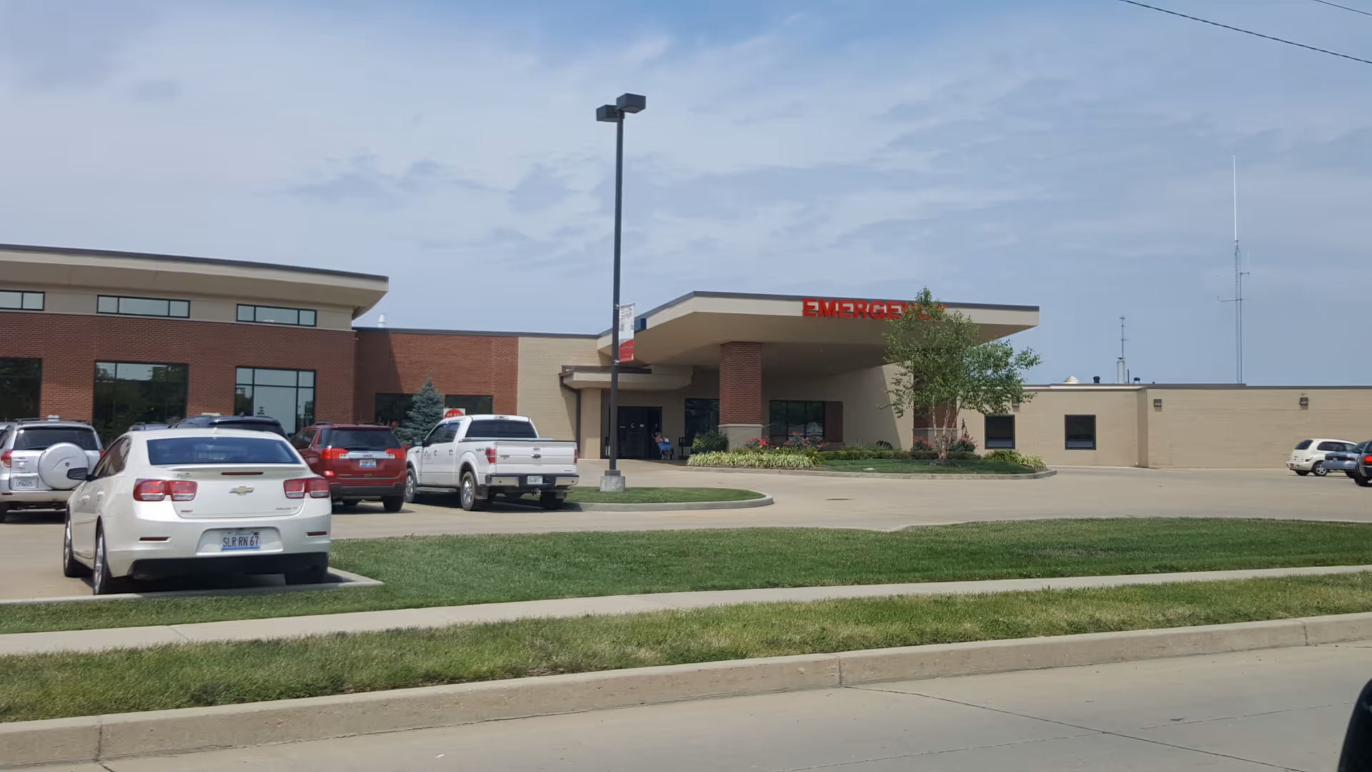 Exterior view of Crawford Memorial Hospital with parking lot and main entrance.
