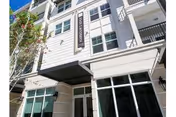 Exterior view of a multi-story senior living building with a Victoria sign.