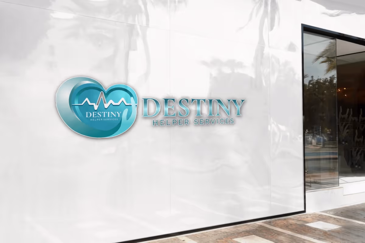 Exterior wall with Destiny Helper Services logo and glass door.