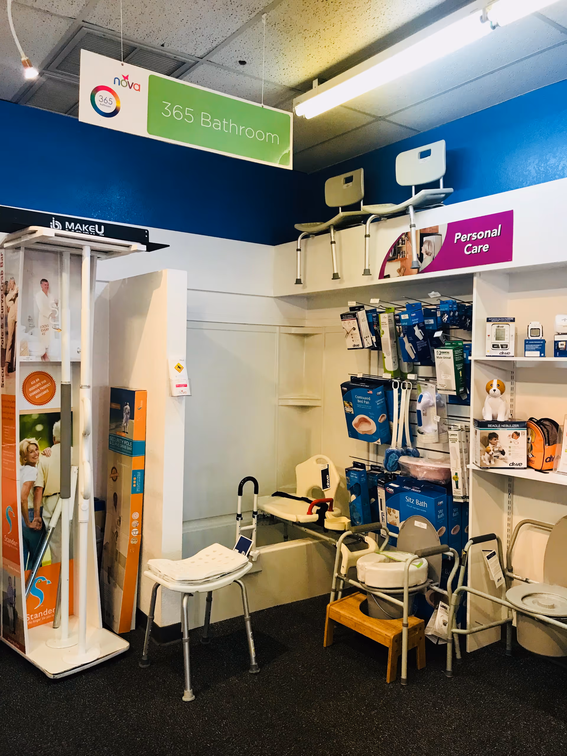 Interior showroom displaying bathroom aids and personal care products on shelves.
