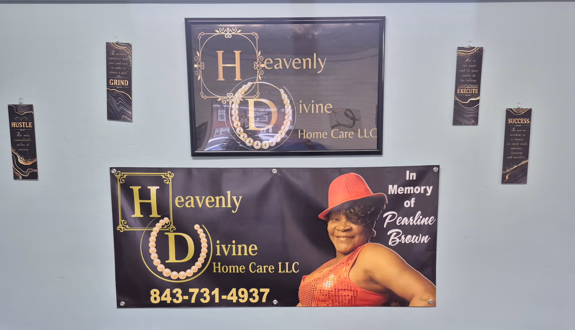 Interior wall displaying Heavenly Divine Home Care LLC signage and a banner with a woman.