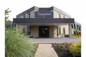 Exterior view of Colonial Park Care Center entrance with landscaping.