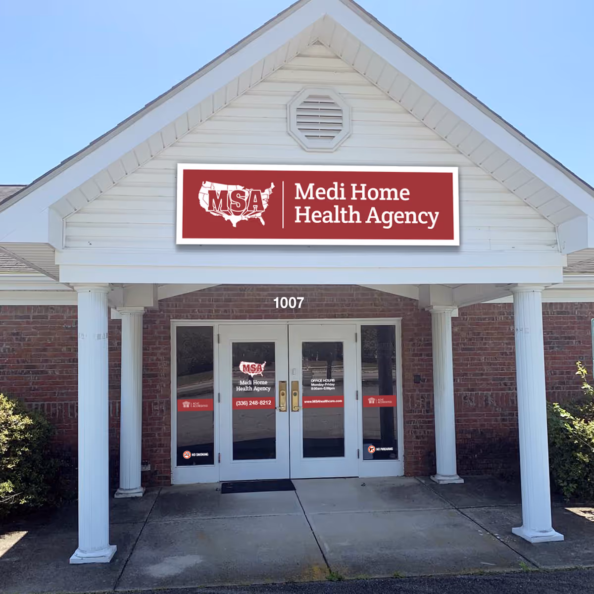 Front exterior of Medi Home Health Agency building with double doors and red sign.