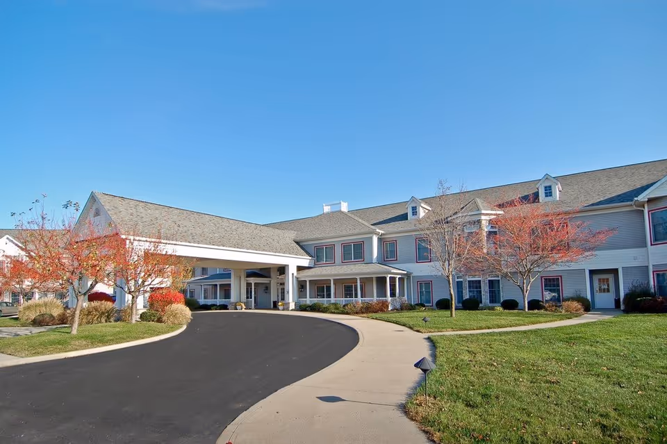 Exterior view of Wynnfield Crossing senior living facility with curved driveway and entrance.