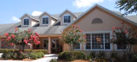 Exterior view of a Brookdale Avondale senior living building with landscaped front entrance.