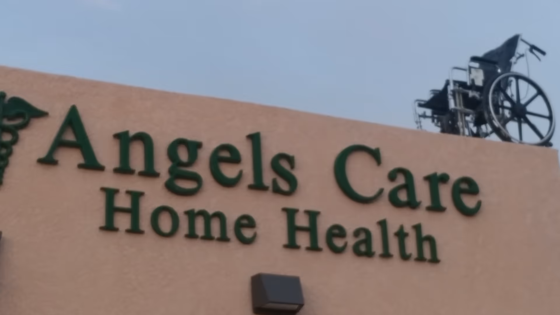 Exterior view of Angels Care Home Health sign with a wheelchair on top