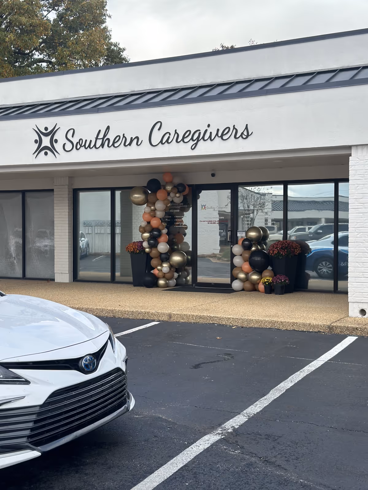 Southern Caregivers of Jonesboro storefront with balloon decorations at the entrance.