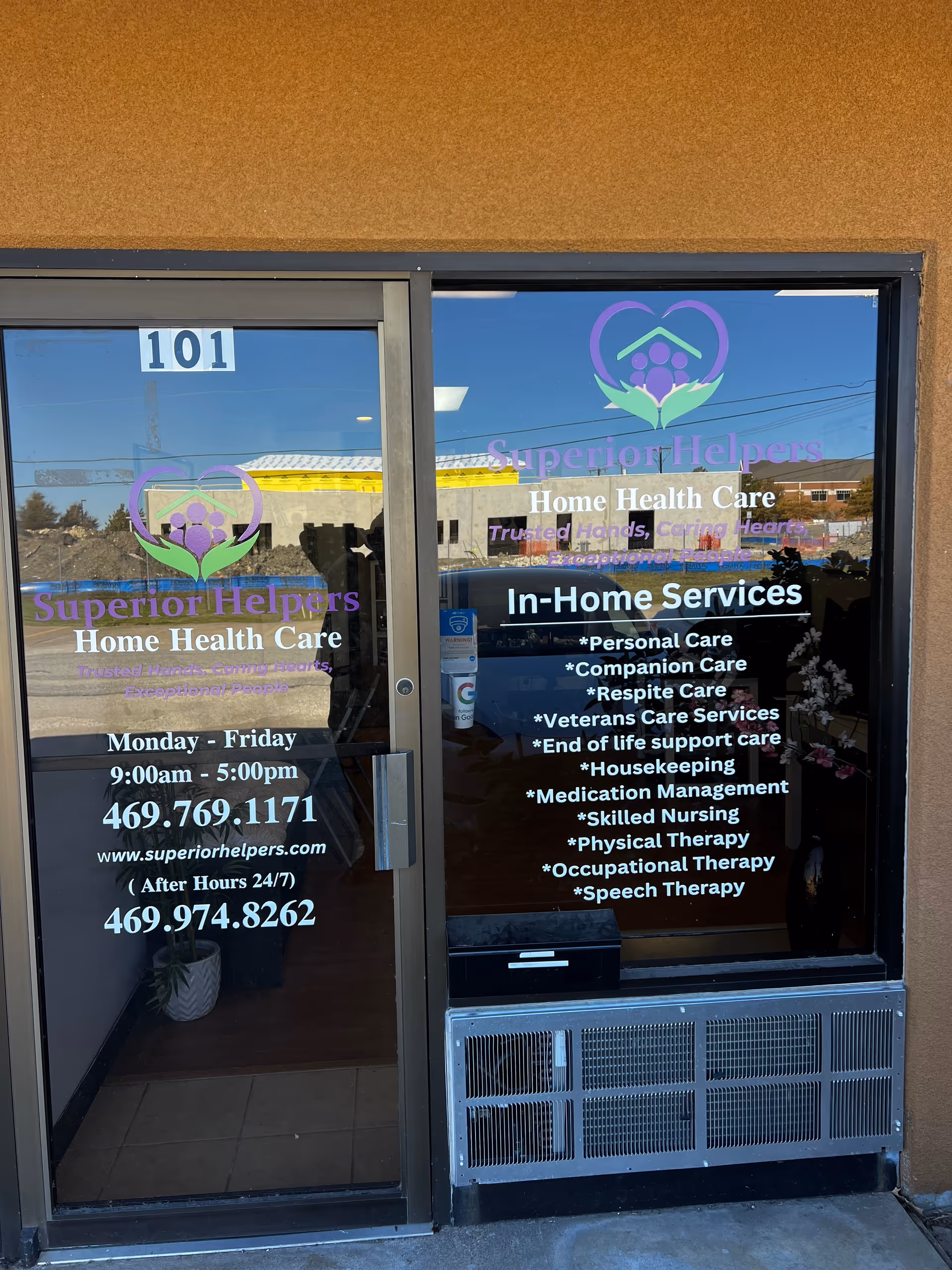 Glass storefront entrance of Superior Helpers Home Health Care with logo and service list