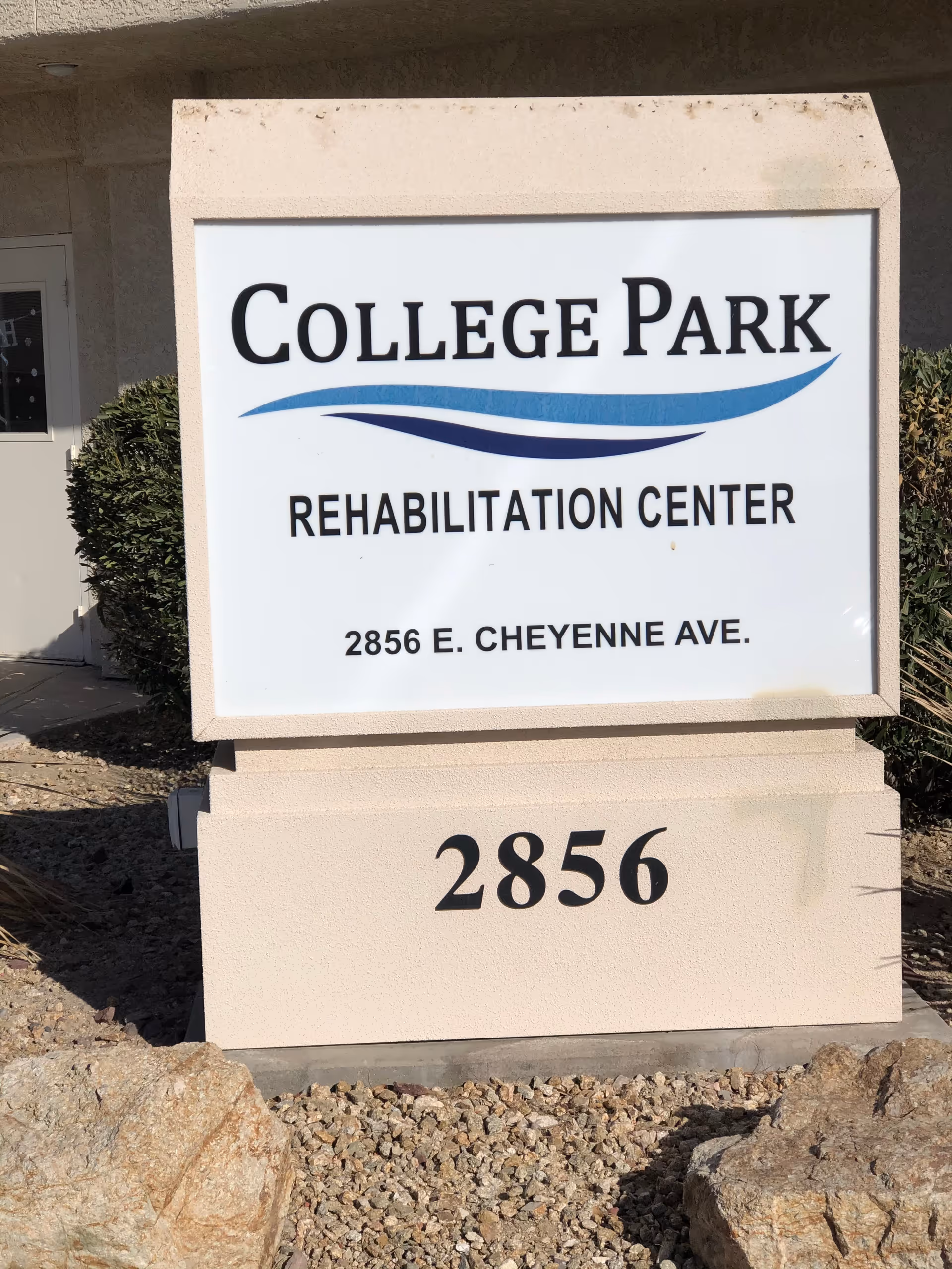 College Park Rehabilitation Center sign on a pedestal outside the building.