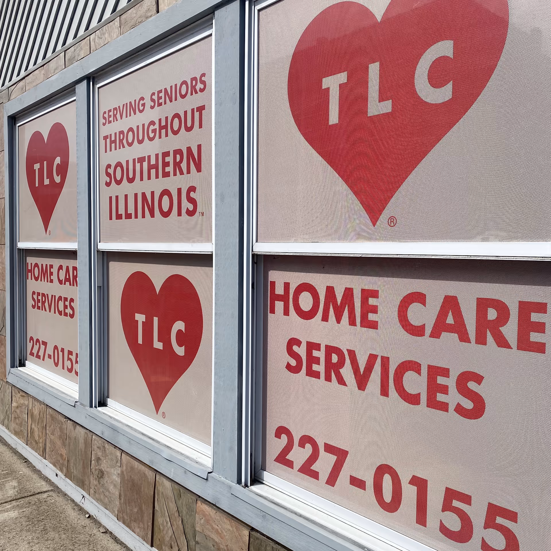 Exterior windows show TLC heart logos and 'Home Care Services' signage.