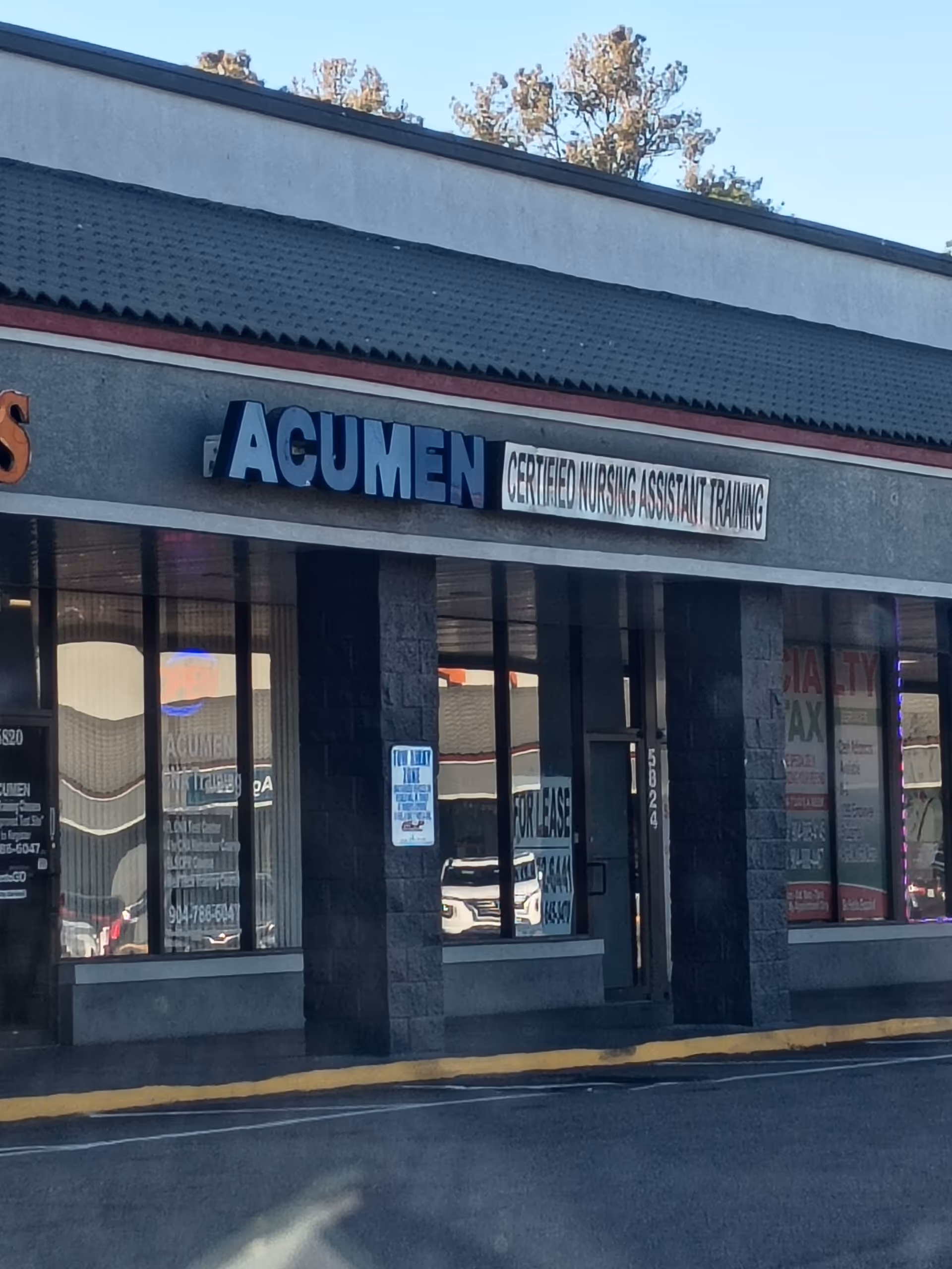 Front exterior of Acumen CNA Training & Testing Center with blue sign