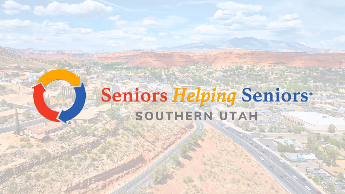Aerial view of a desert town with the Seniors Helping Seniors Southern Utah logo.
