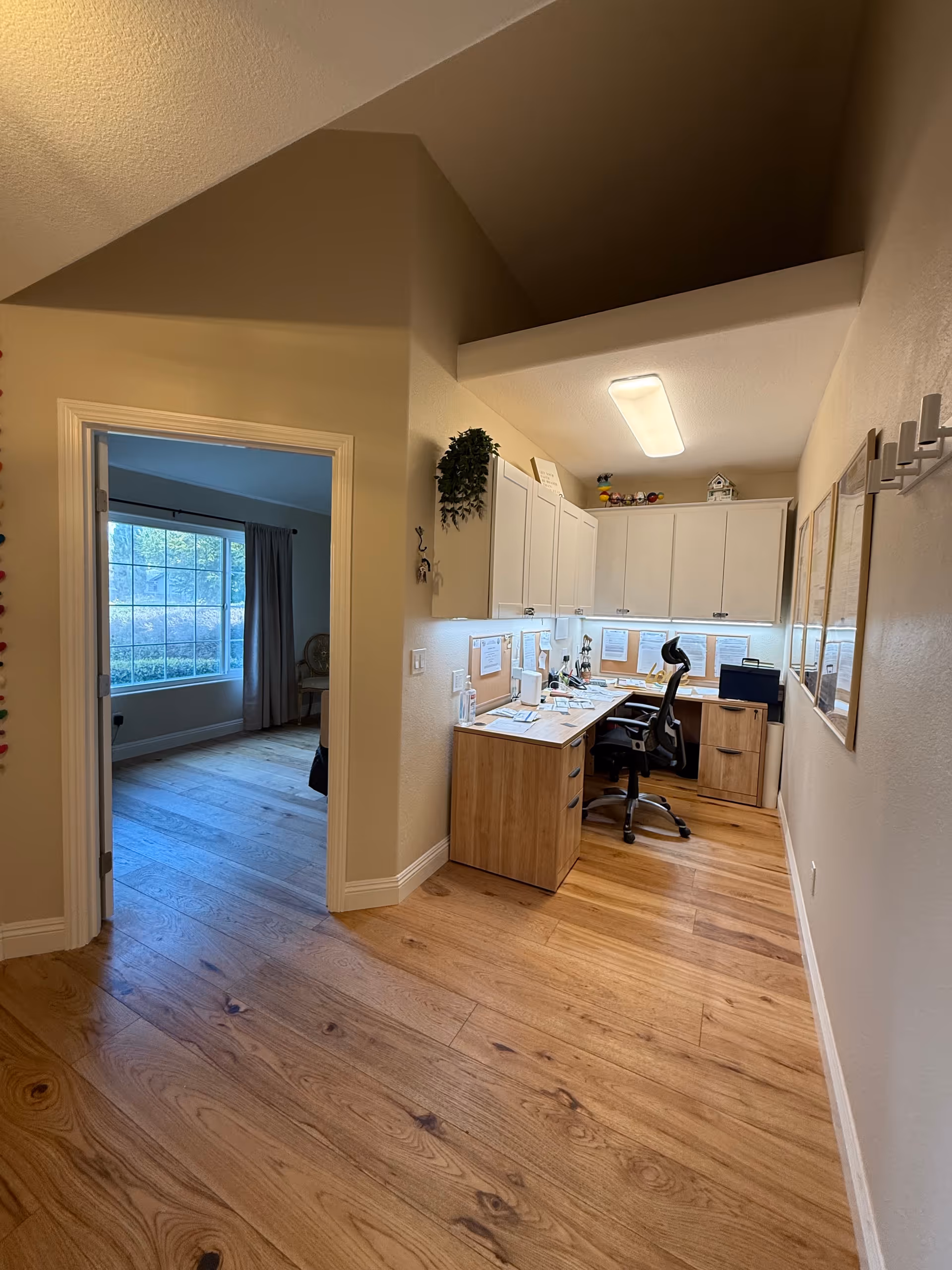 Interior office area with desk, cabinets, and an office chair in a senior facility.