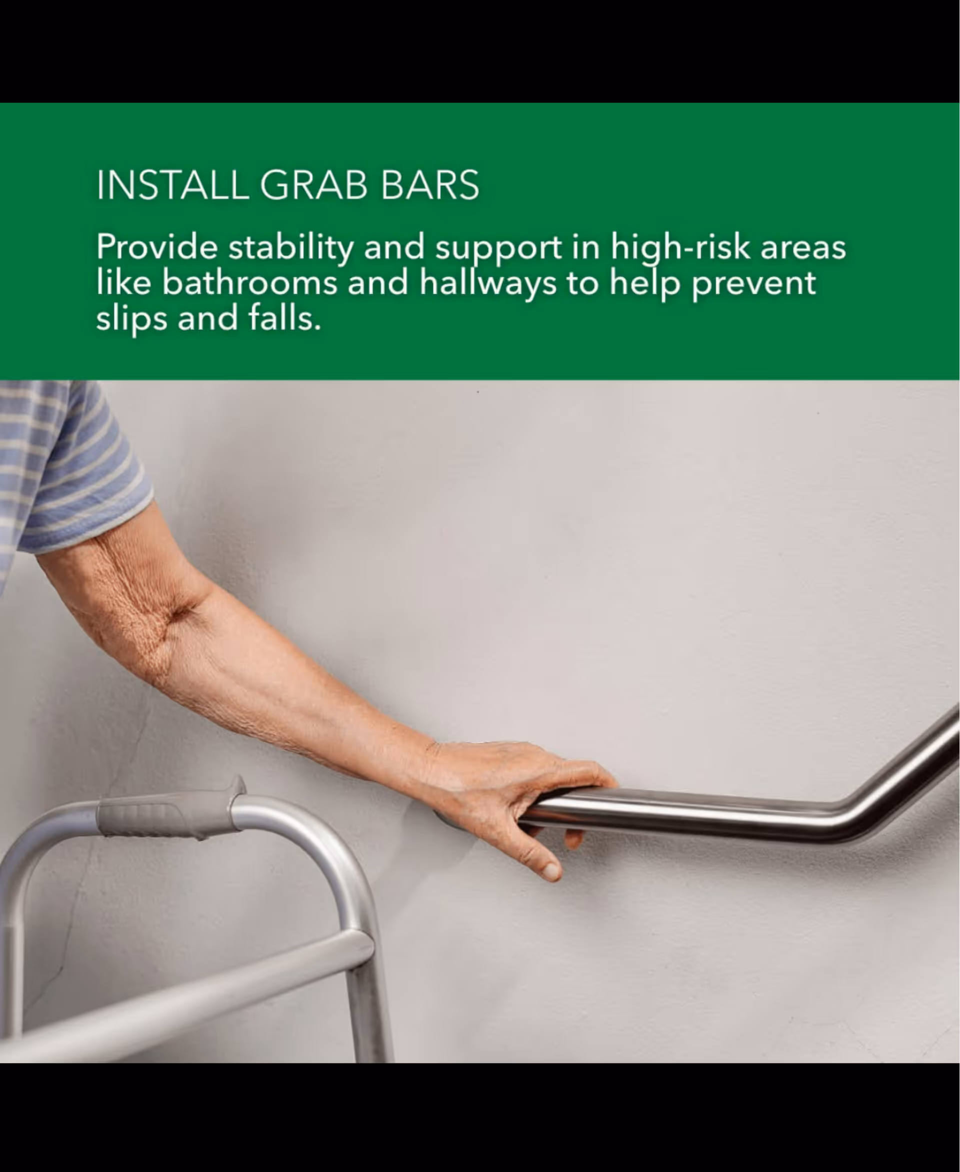 Elderly hand grasps a metal grab bar beside a walker in a hallway.