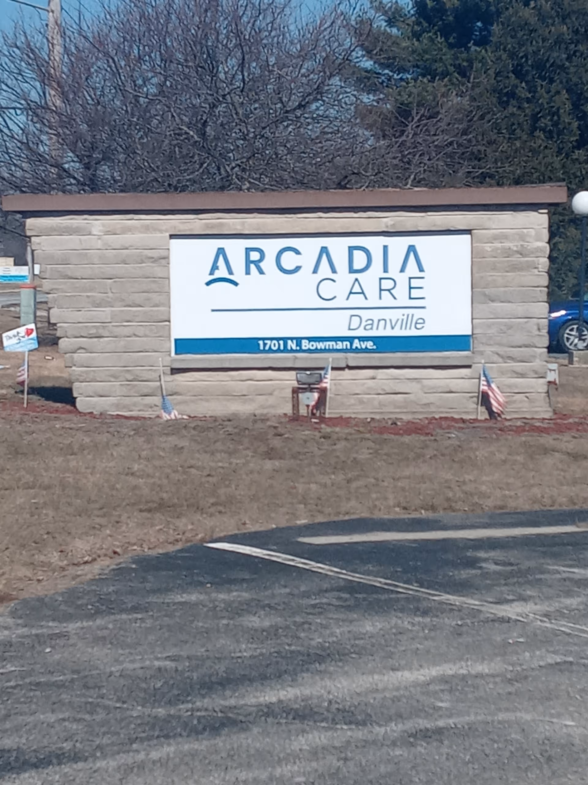 Exterior sign for Arcadia Care Danville on a brick monument at the facility entrance.