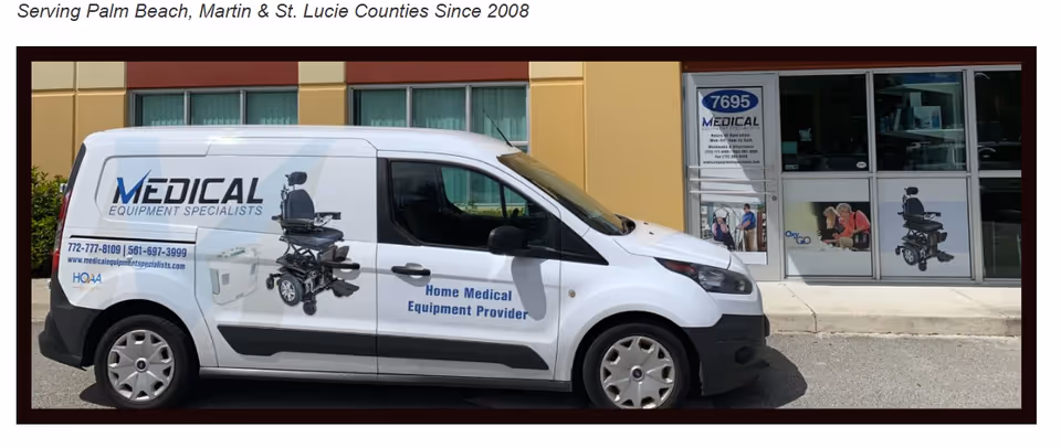 White van labeled Medical Equipment Specialists parked outside a storefront.