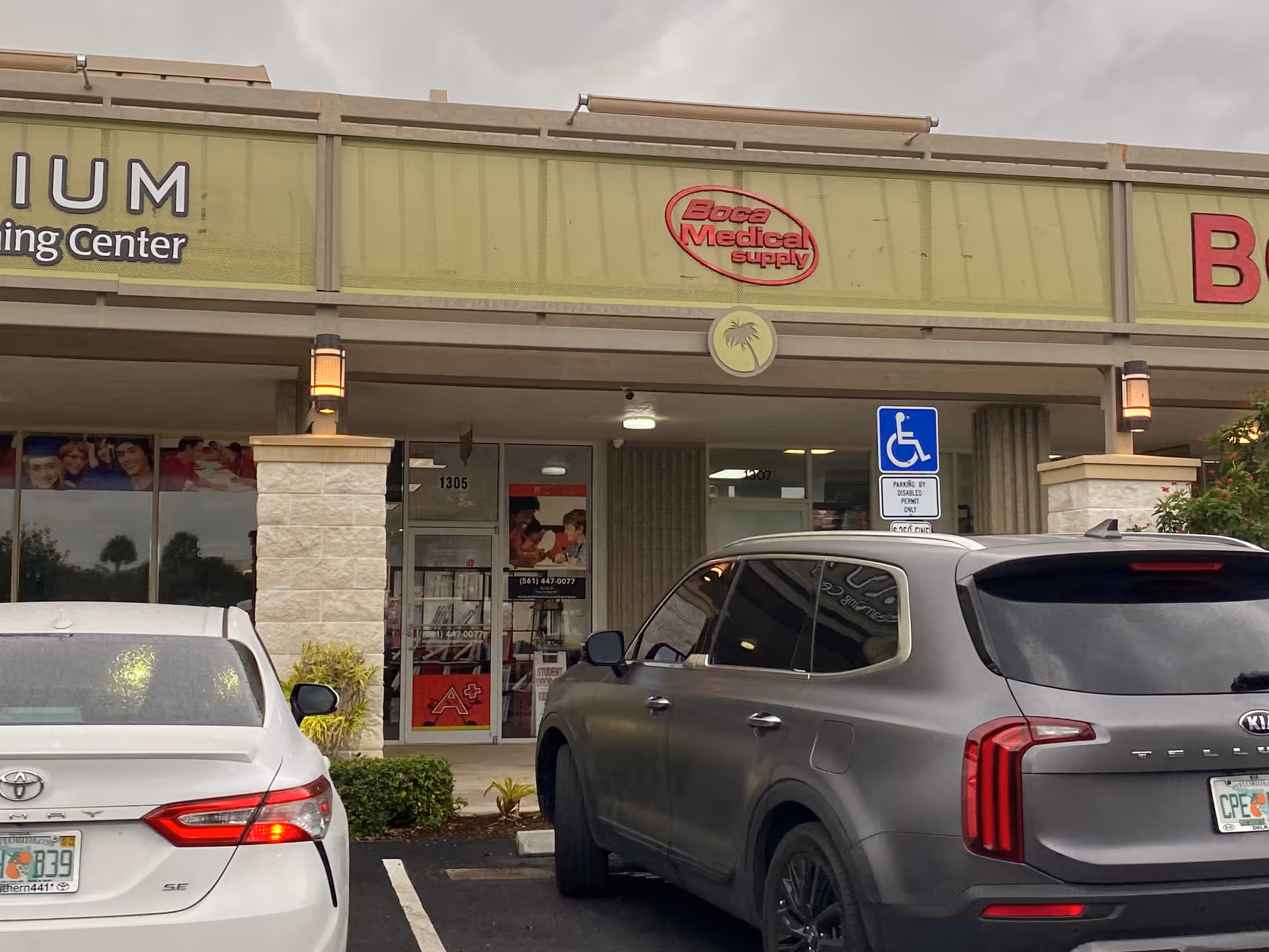 Exterior view of Boca Medical Supply storefront at Palmetto Park Square with parked cars.