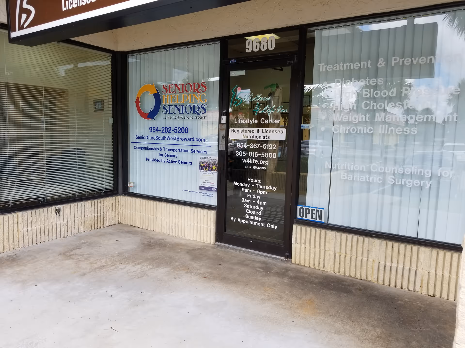 Storefront of Seniors Helping Seniors Southwest Broward with large glass windows and door.