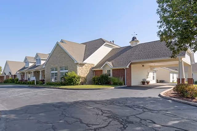Exterior view of Brookdale Great Bend senior living facility with driveway and entrance