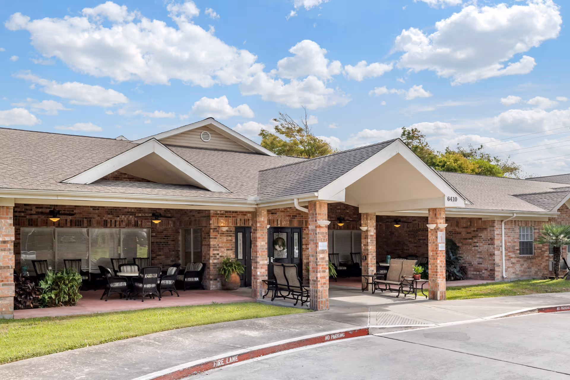 Brookdale Corpus Christi facility exterior with brick walls and covered seating area