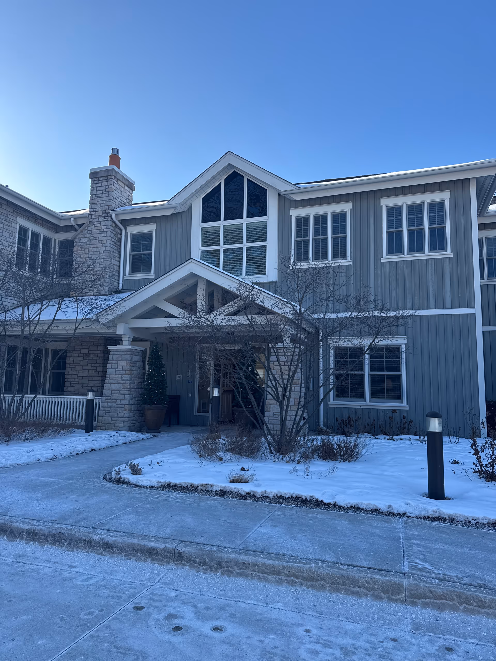 Front exterior view of JourneyCare Home Health building with snow-covered landscaping.
