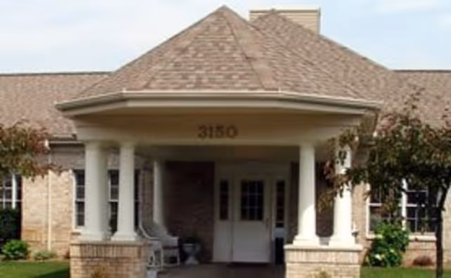 Front entrance of Brookdale Portage with columns and a covered porch.