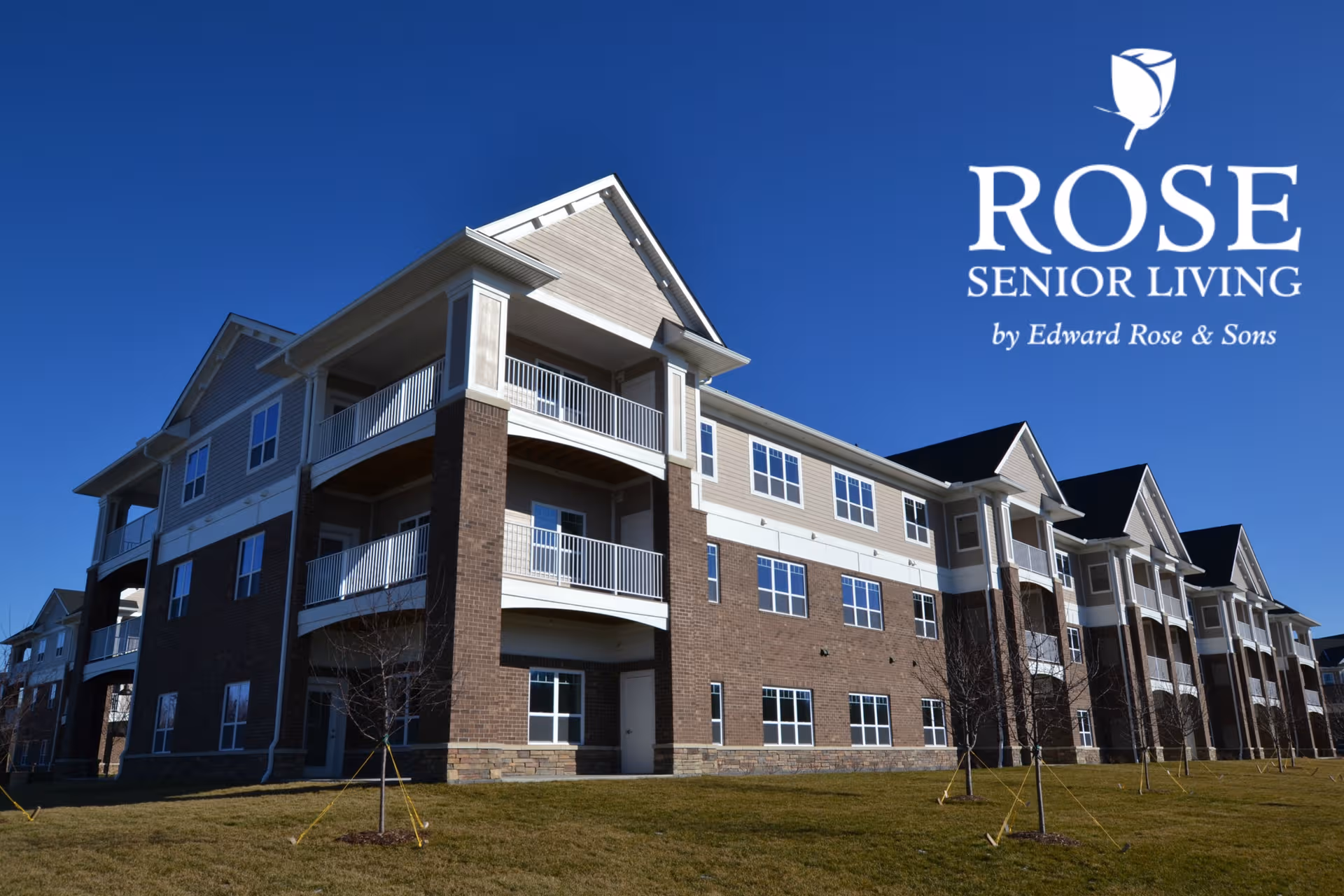 Exterior view of Rose Senior Living Beachwood building with balconies under a blue sky