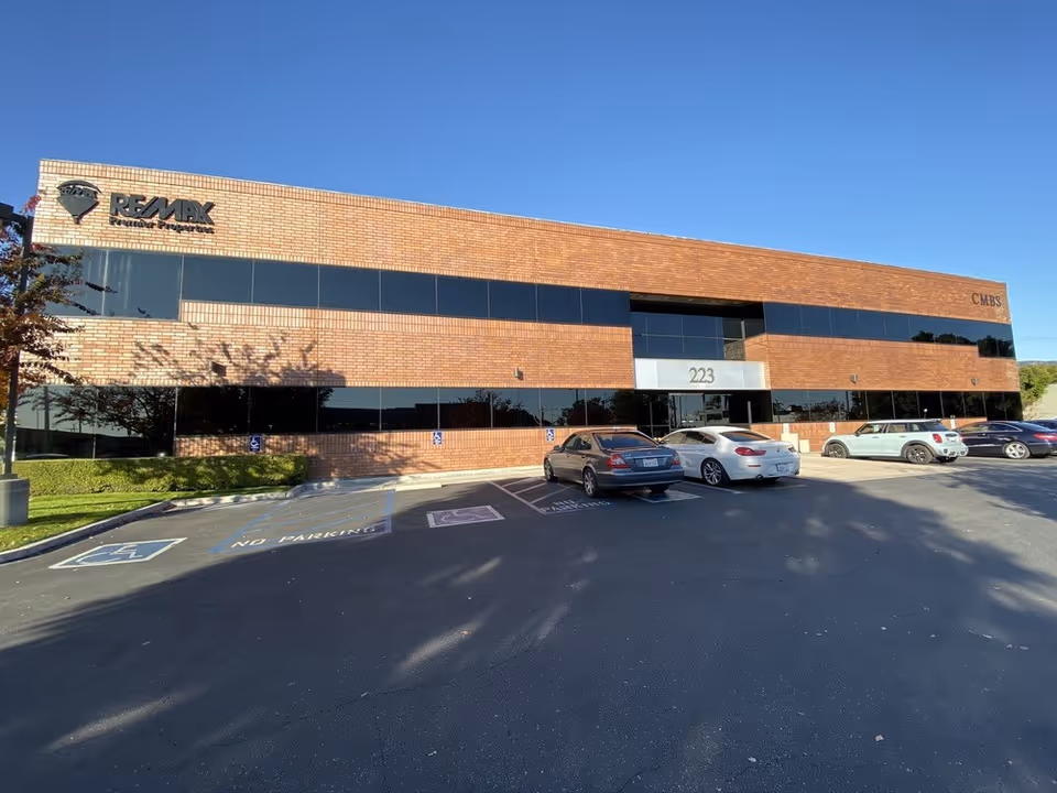Exterior view of Practicare Home Health Inc building with a parking lot.