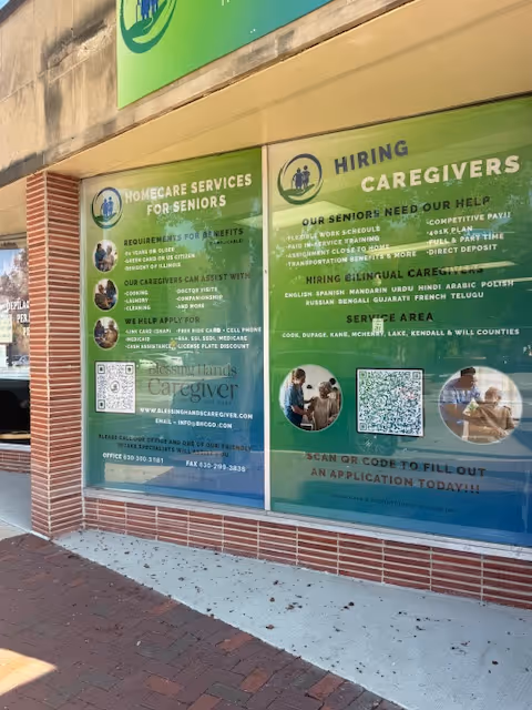 Two large green posters advertising home care services and hiring caregivers on a storefront window.