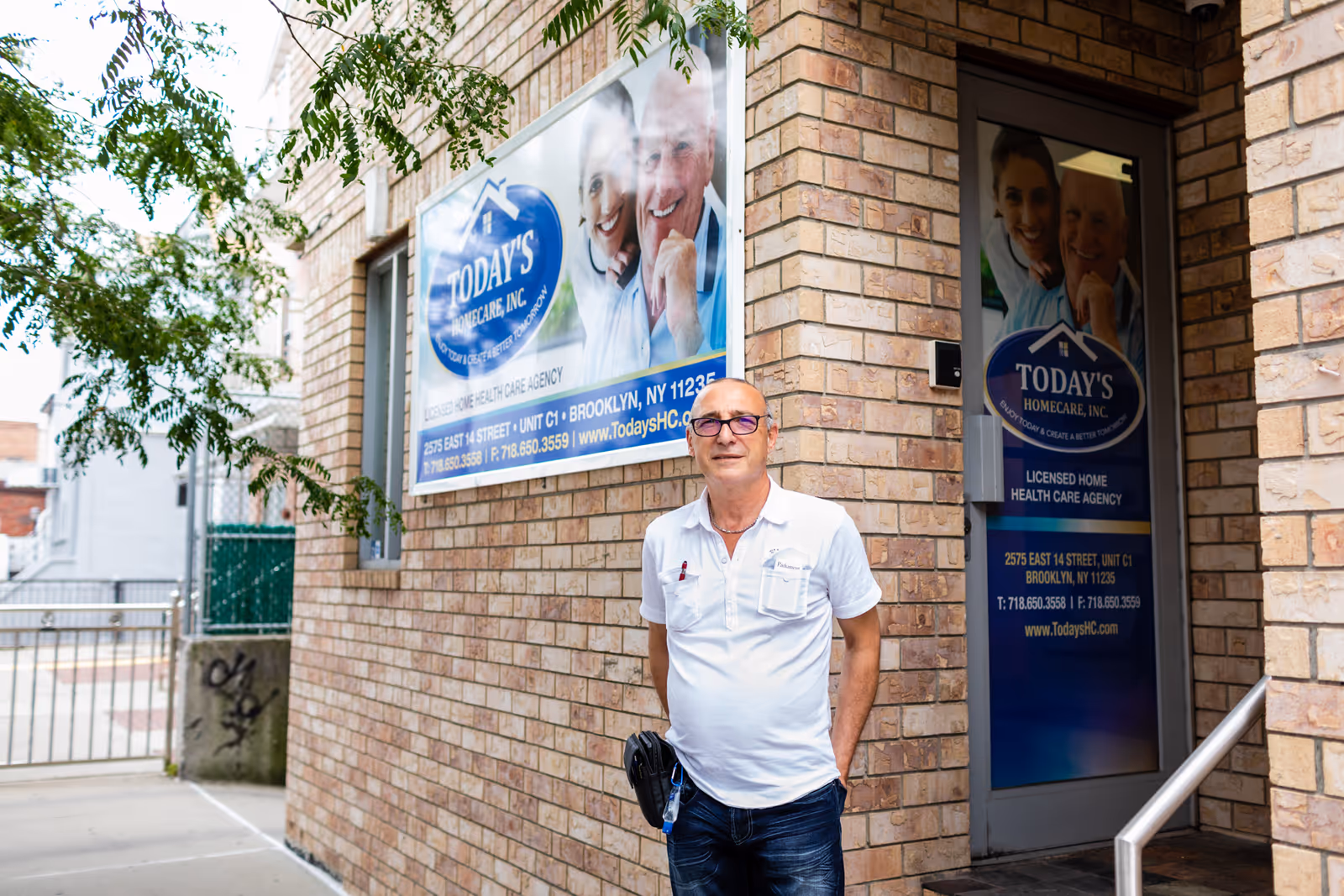 Man stands outside a brick building with Today's Homecare, Inc. signage.