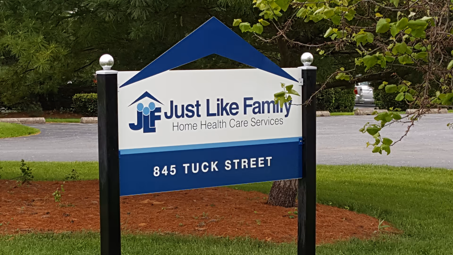 Exterior sign shows Just Like Family Home Health Care Services with address 845 Tuck Street.