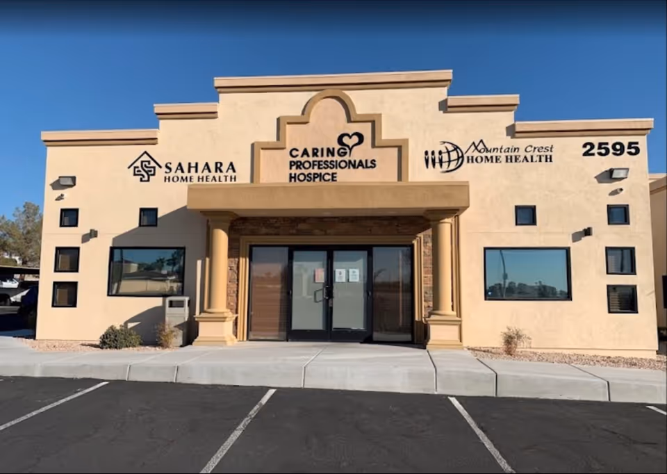 Front exterior of Mountain Crest Home Health building with beige stucco and signage.