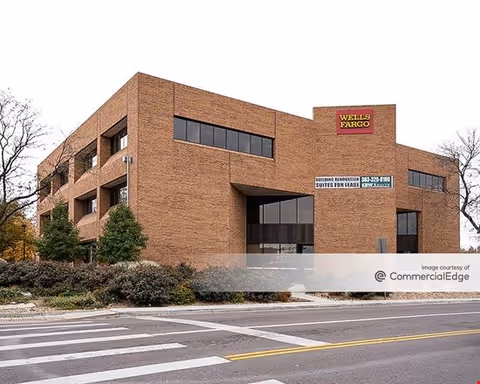 Brick building exterior with large windows and a Wells Fargo sign.