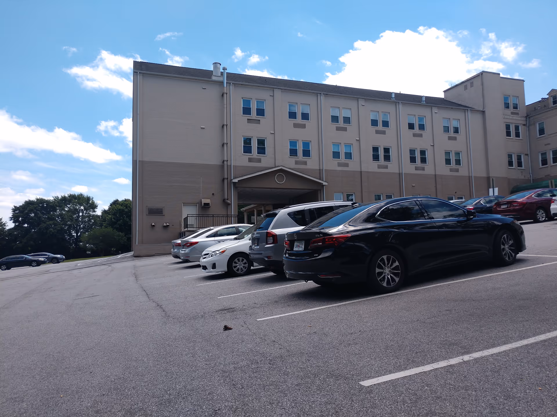 Exterior view of Pruitthealth - Decatur building with a parking lot in foreground.