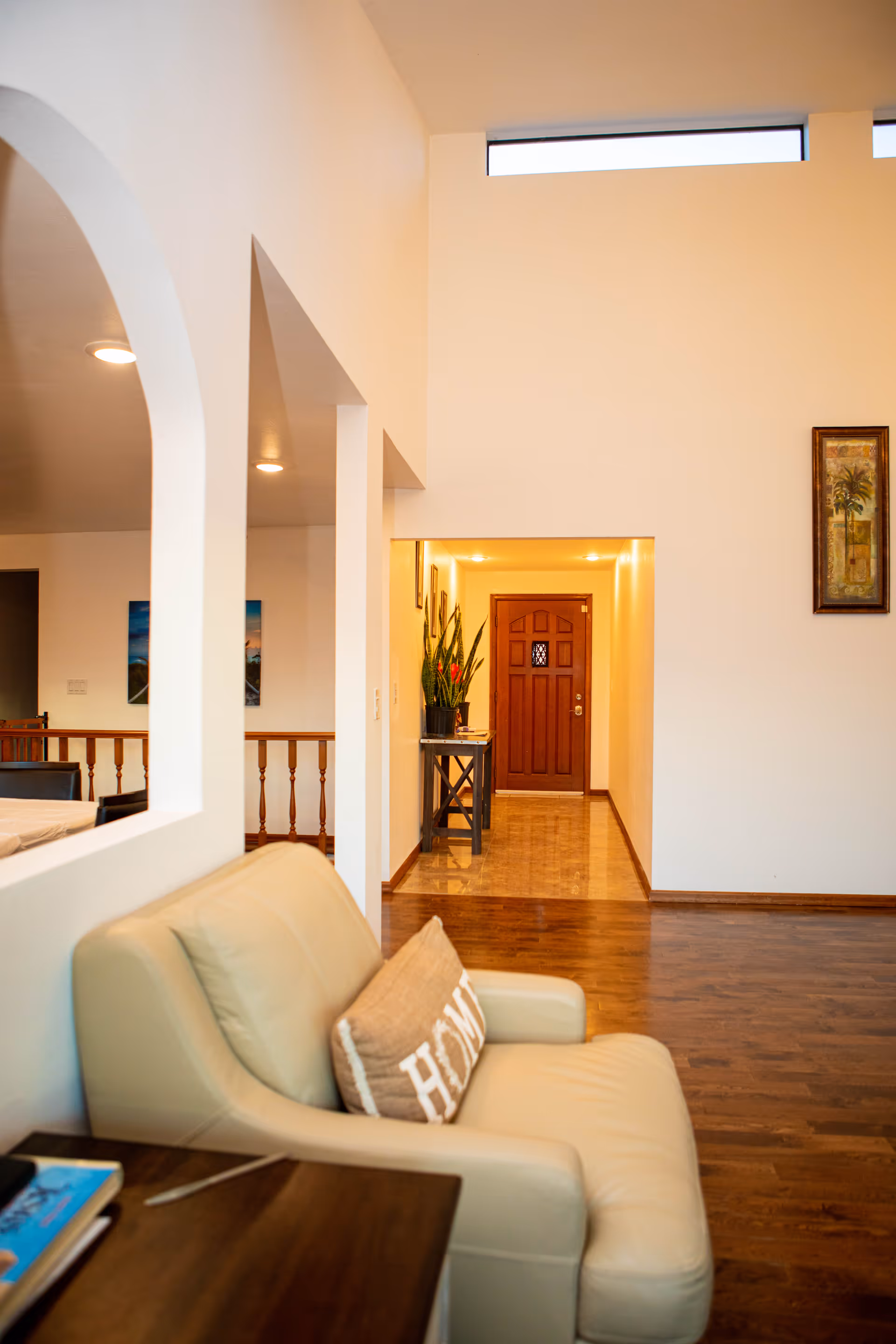Interior living room at El Shaddai AFH/Senior Care Facility with sofa and arches.