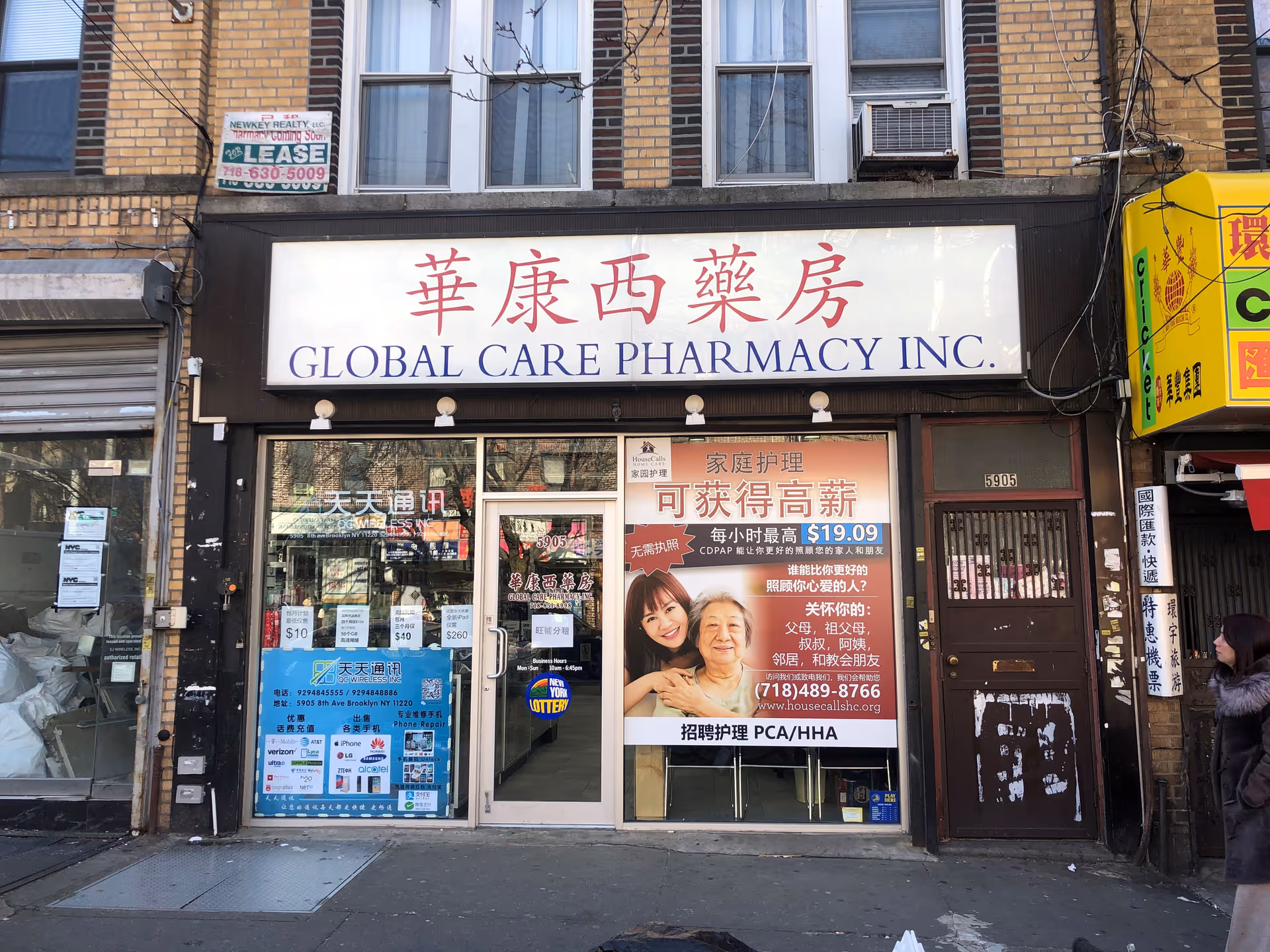 Storefront of Global Care Pharmacy Inc. with a large elderly care poster in the window.