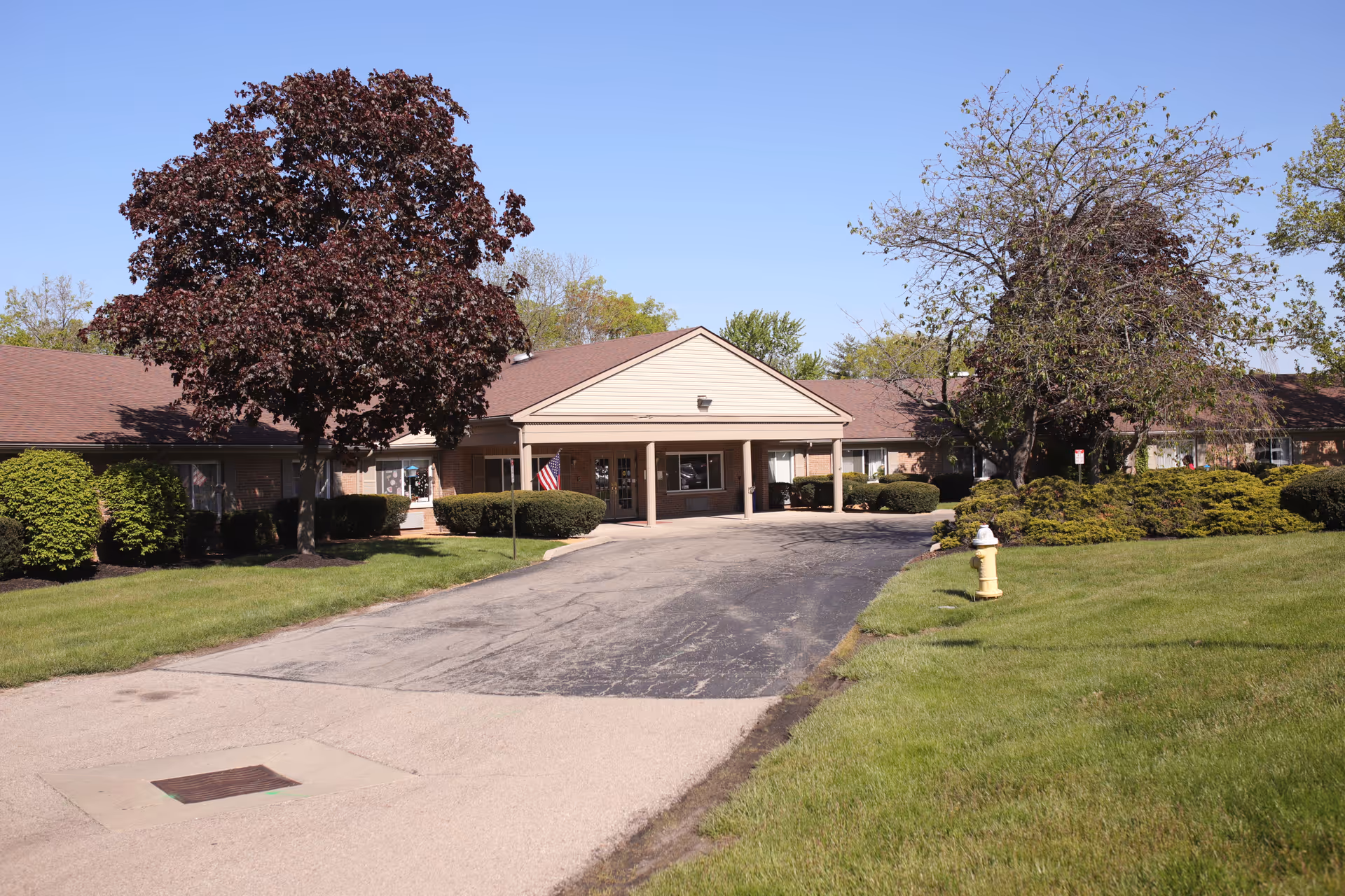 Front view of a single-story ProMedica Kettering building with a covered entrance and driveway.