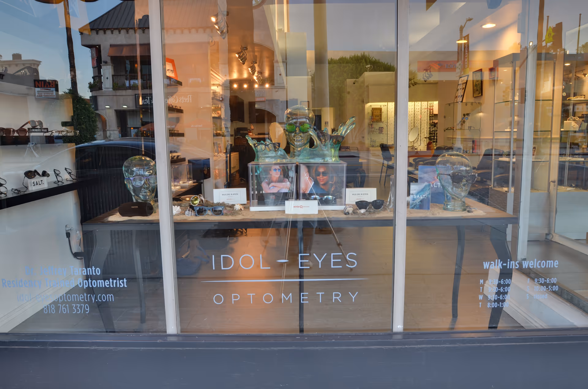 Storefront window display of eyewear and sunglasses at Idol Eyes Optometry.
