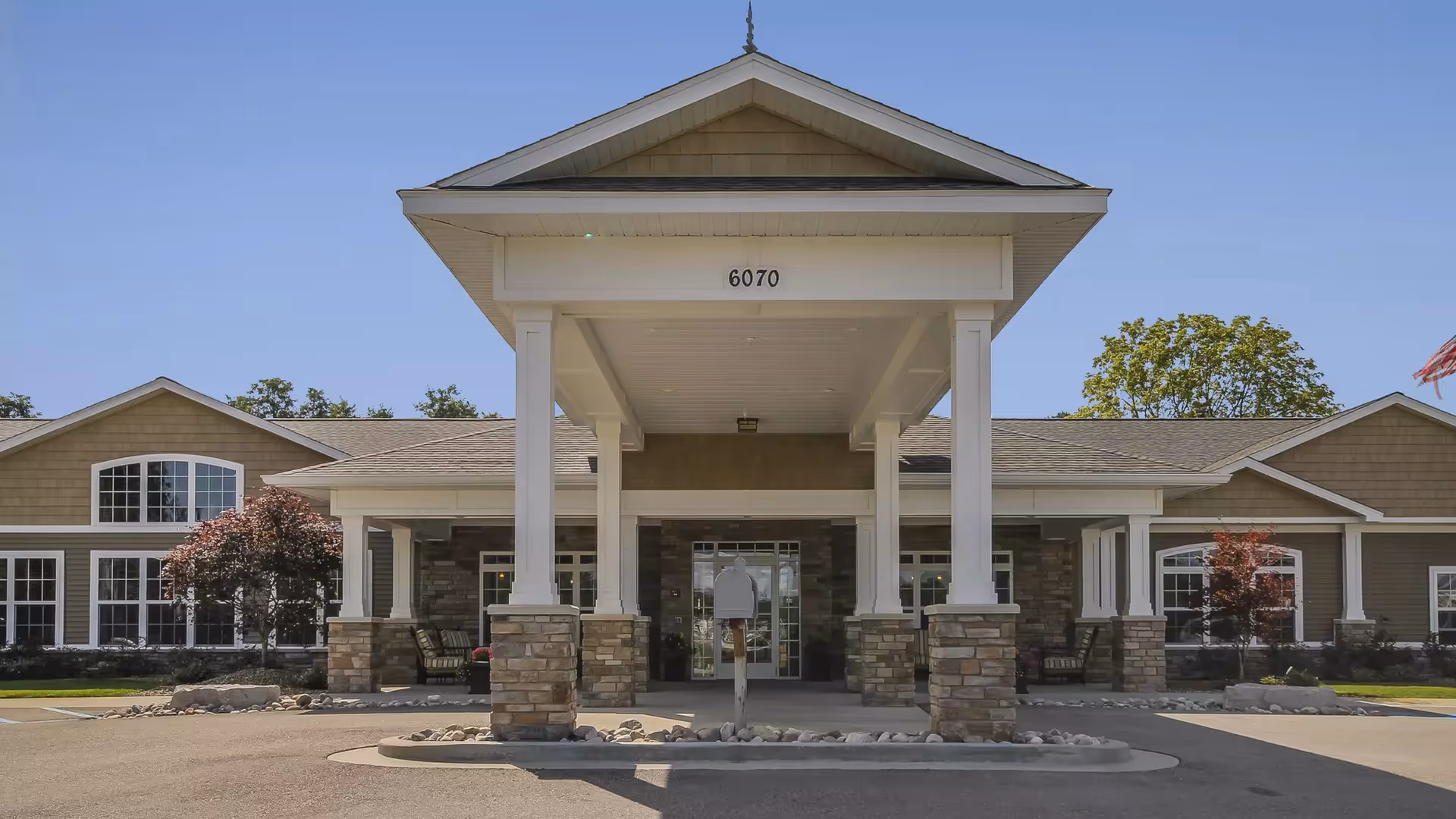 Front entrance of Boulder Creek Assisted Living & Memory Care with stone columns.