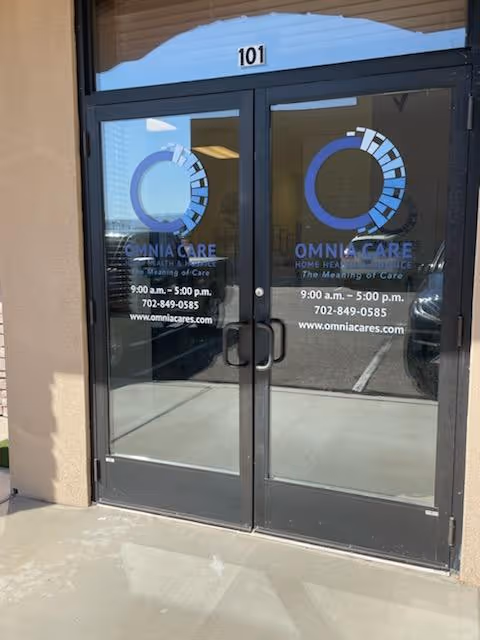 Glass entrance doors display OmniCare logos and hours at the building entrance.