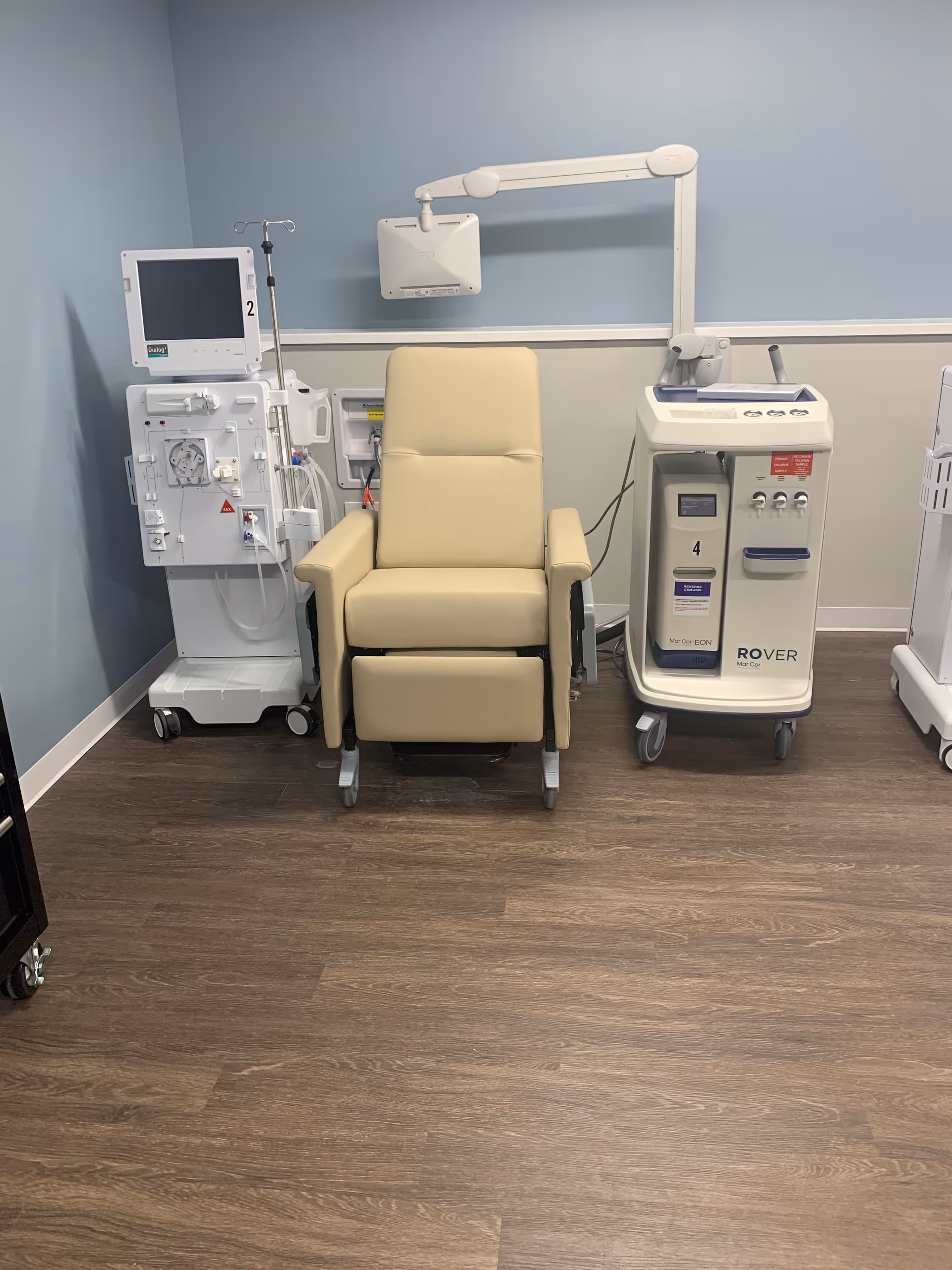 Medical treatment chair with monitoring equipment in a clinical room at Bella Terra Lombard