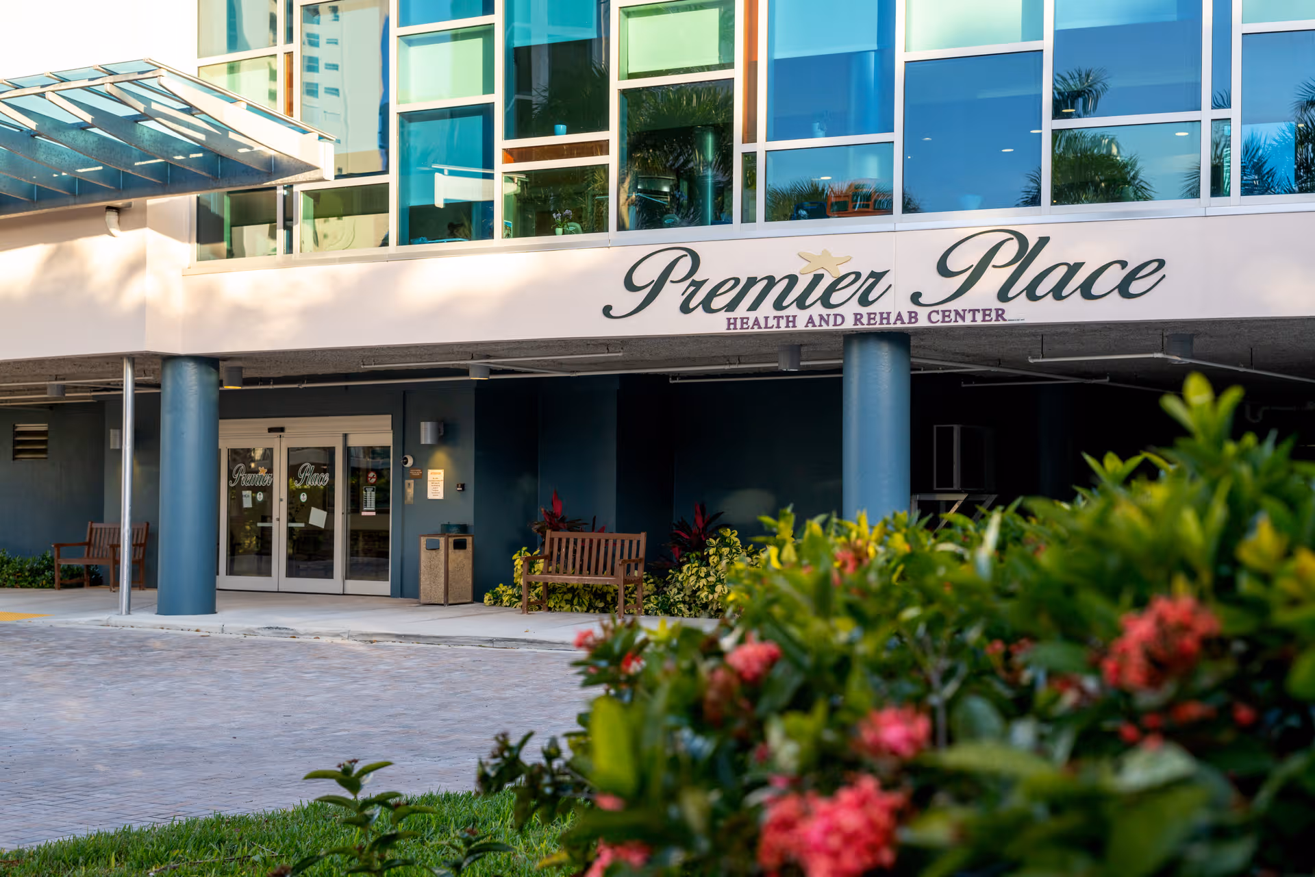 Front entrance of Premier Place Health and Rehab Center with glass windows