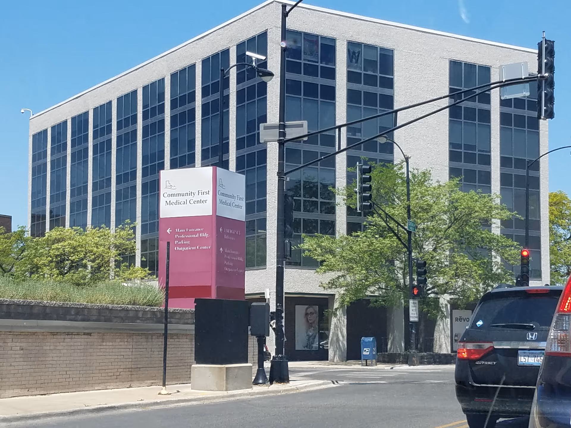 Community First Medical Center building with glass windows on a city street.