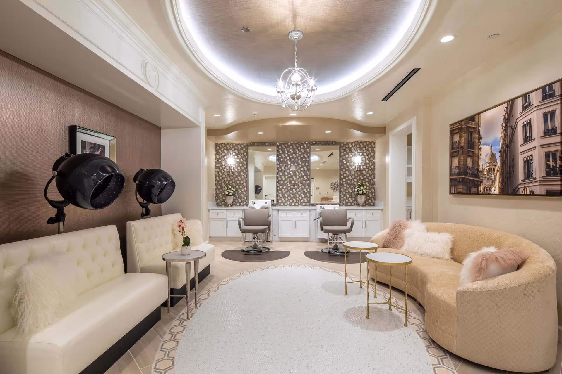 Elegant senior living lounge with curved sofa, salon chairs, and a stylish hair styling area.