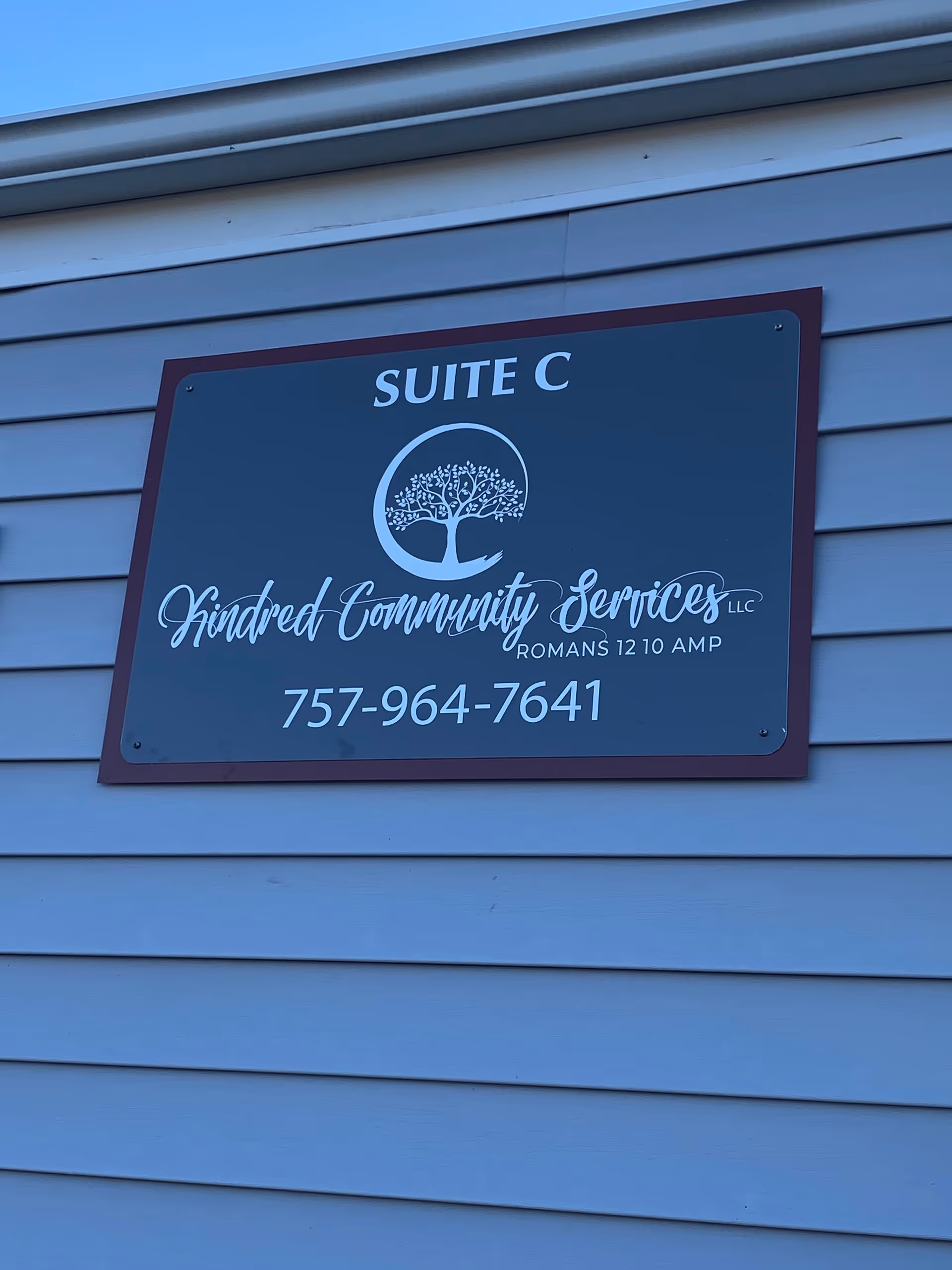Exterior wall sign reads Suite C for Kindred Community Services LLC