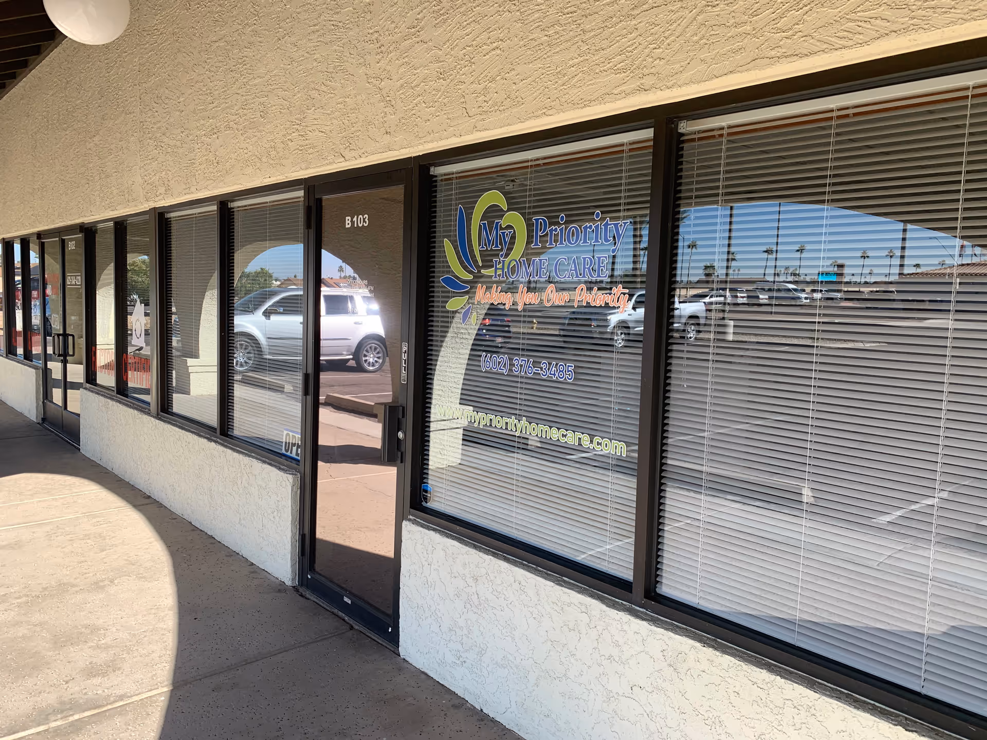 Exterior storefront of My Priority Home Care with glass doors and window signage.