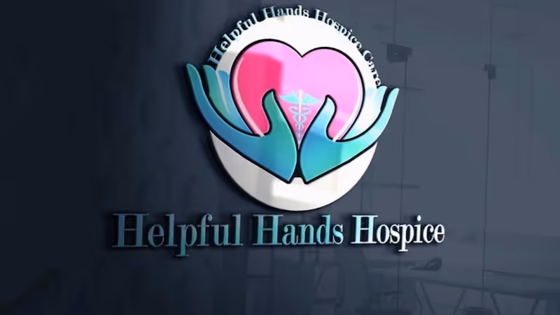 Sign on a dark wall reading Helpful Hands Hospice with a heart and hands logo.